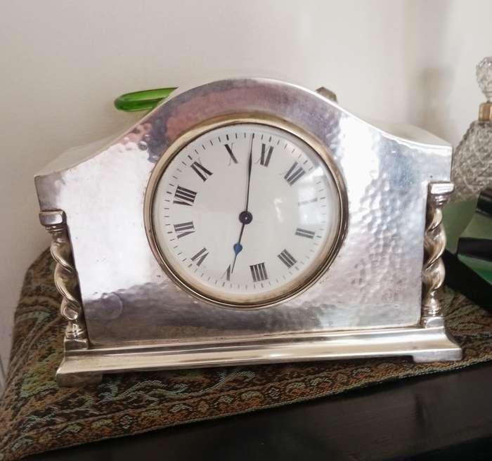 A fine silver plate vintage mantle clock in working order