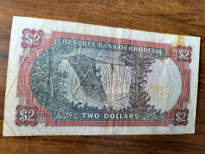 JOB LOT 1979-1994... 5x RHODESIA/ZIMBABWE Bank Notes (Lot). Bid Per Lot) Selling As Pictured...