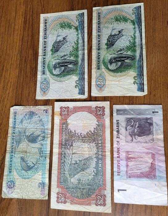 JOB LOT 1979-1994... 5x RHODESIA/ZIMBABWE Bank Notes (Lot). Bid Per Lot) Selling As Pictured...