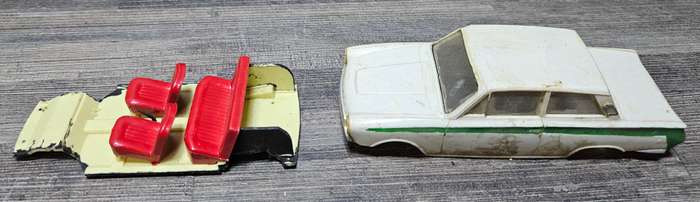 Vintage toy car parts as pictured