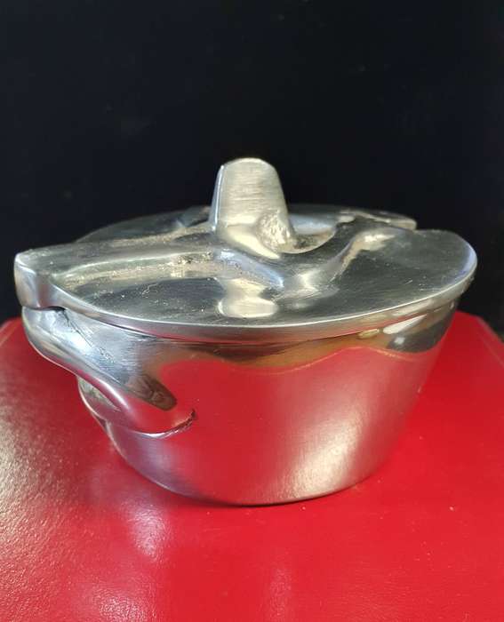 HANNEKE BRAND PEWTER AND STAINLESS SUGAR BOWL. WOMEN HOLDING LID .