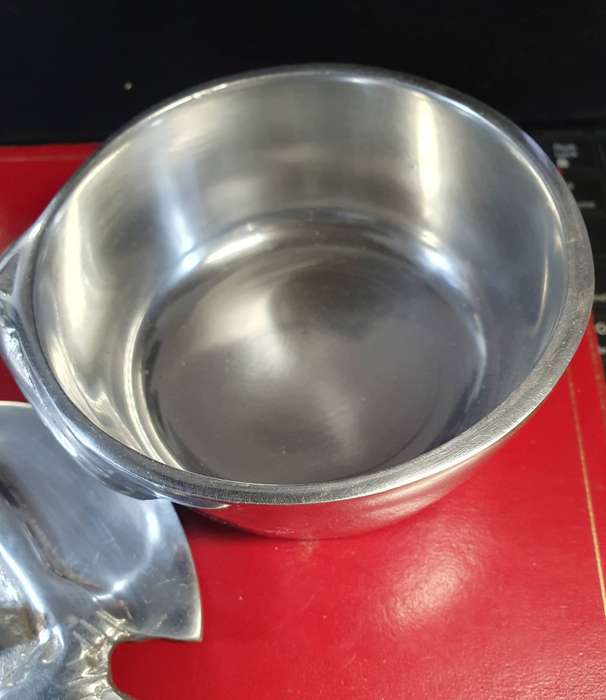 HANNEKE BRAND PEWTER AND STAINLESS SUGAR BOWL. WOMEN HOLDING LID .