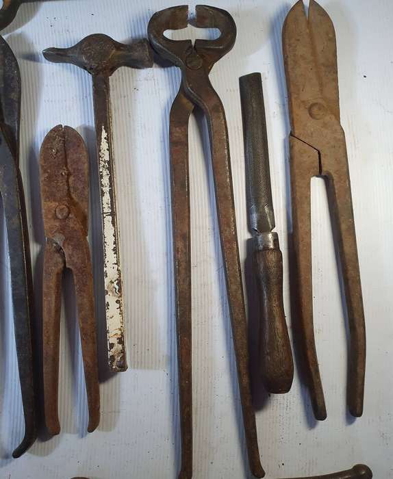 9 X ANTIQUE BLACK SMITH TOOLS INCLUDING HUGE STEEL CLIPPER. ONE BID FOR ALL.