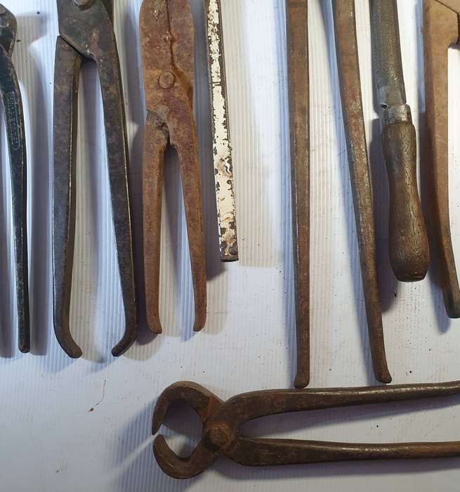 9 X ANTIQUE BLACK SMITH TOOLS INCLUDING HUGE STEEL CLIPPER. ONE BID FOR ALL.