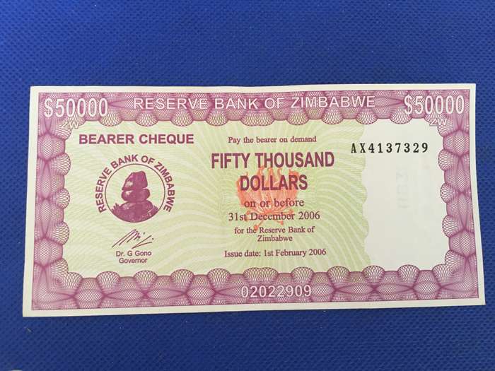 ZIMBABWE FIFTY THOUSAND DOLLARS  BEARER CHEQUE UNC CONDITION 2006 SEREAL NUMBER - AX4137329