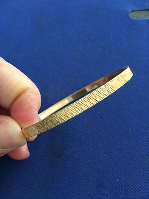 LOVELY GOLD TONE BANGLE