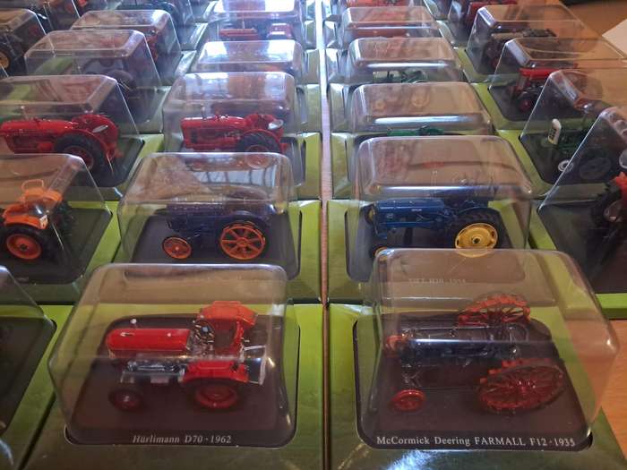 Complete set of Hachette series of diecast model tractors.