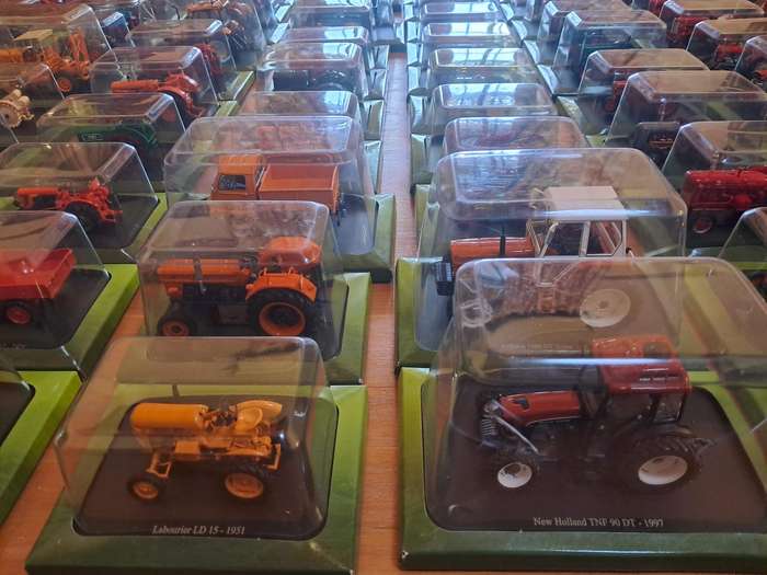 Complete set of Hachette series of diecast model tractors.