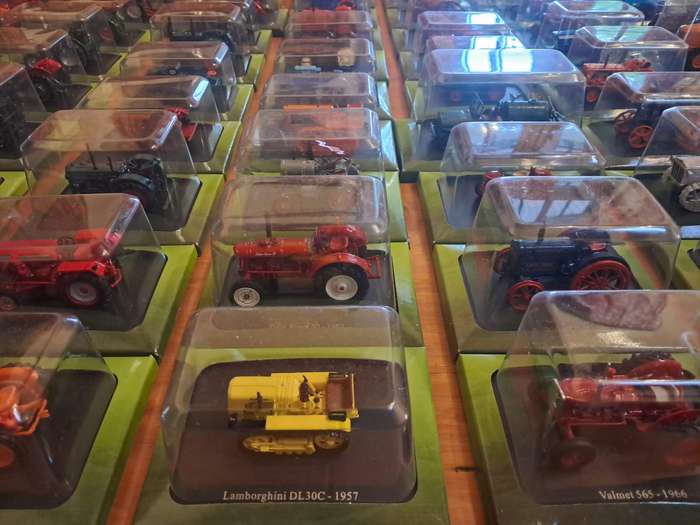 Complete set of Hachette series of diecast model tractors.