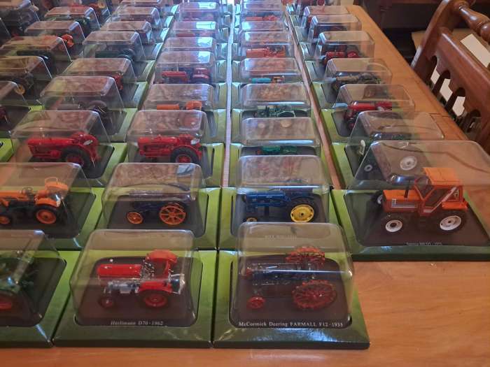 Complete set of Hachette series of diecast model tractors.