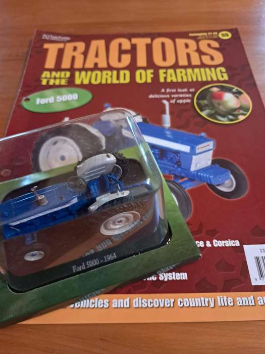 Complete set of Hachette series of diecast model tractors.