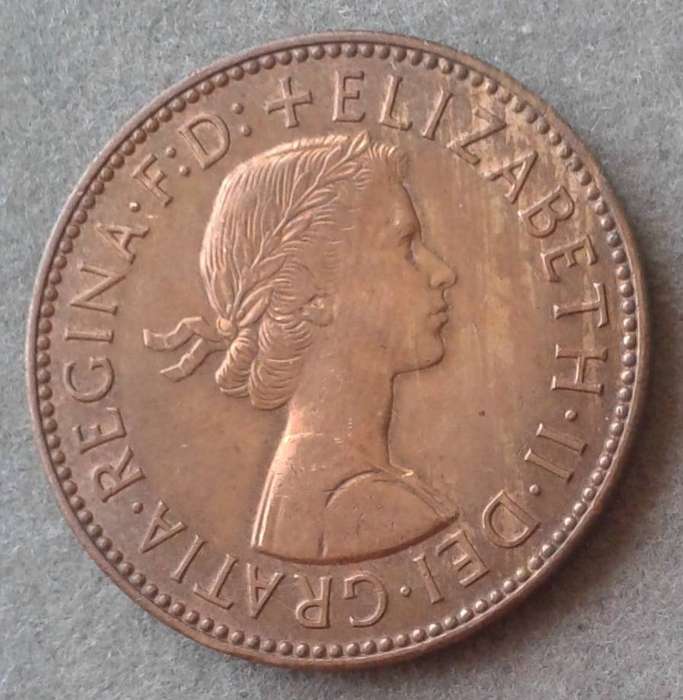 1959 Uncirculated british 1/2 Penny in a capsule.