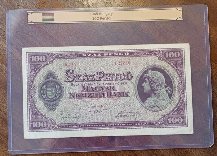 1945 WW2 Hungary 100 Pengő note in hard plastic sleeve