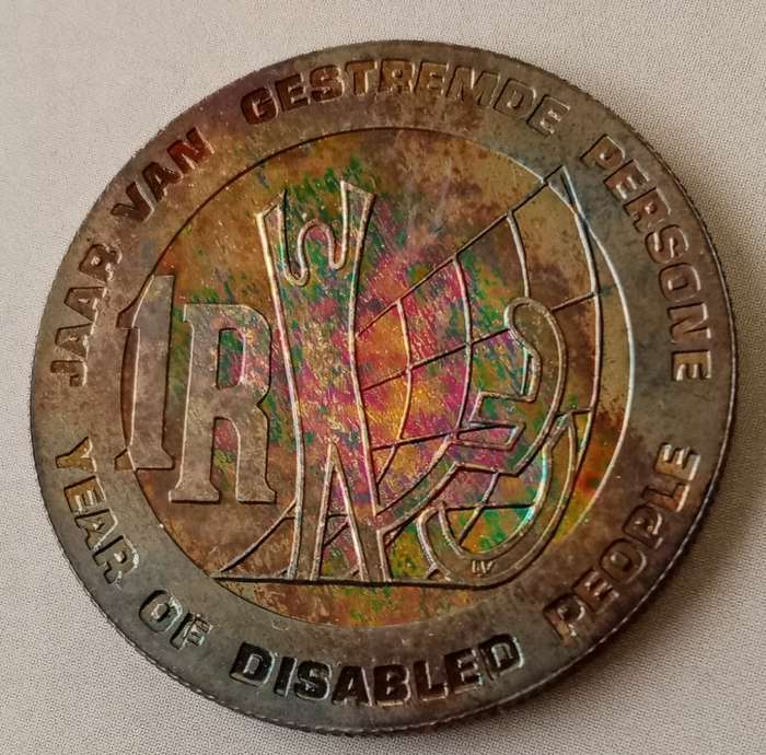 Nice 1986 YOD proof silver R1 with rainbow toned reverse