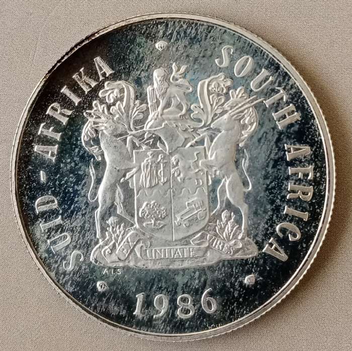 Nice 1986 YOD proof silver R1 with rainbow toned reverse