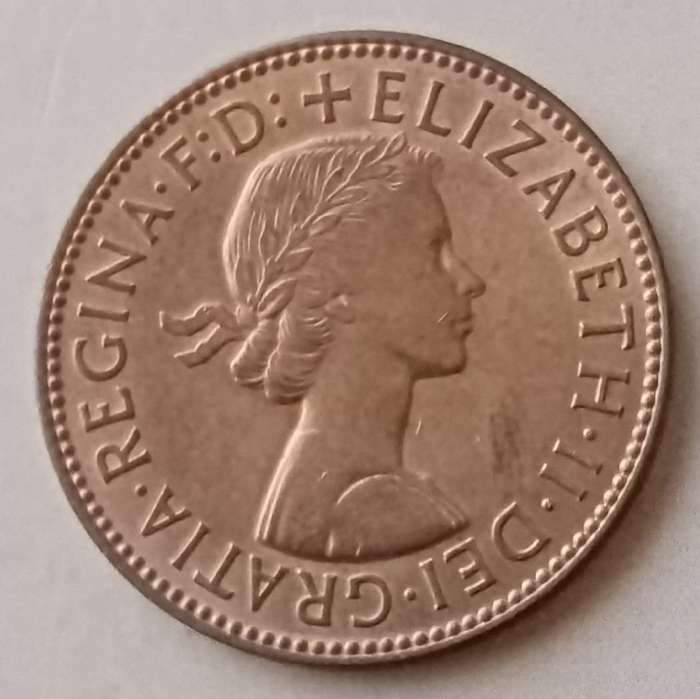 Uncirculated 1959 British 1/2 Penny in a capsule