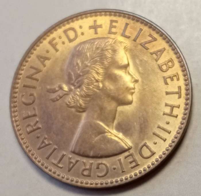 Uncirculated 1959 British 1/2 Penny in a capsule
