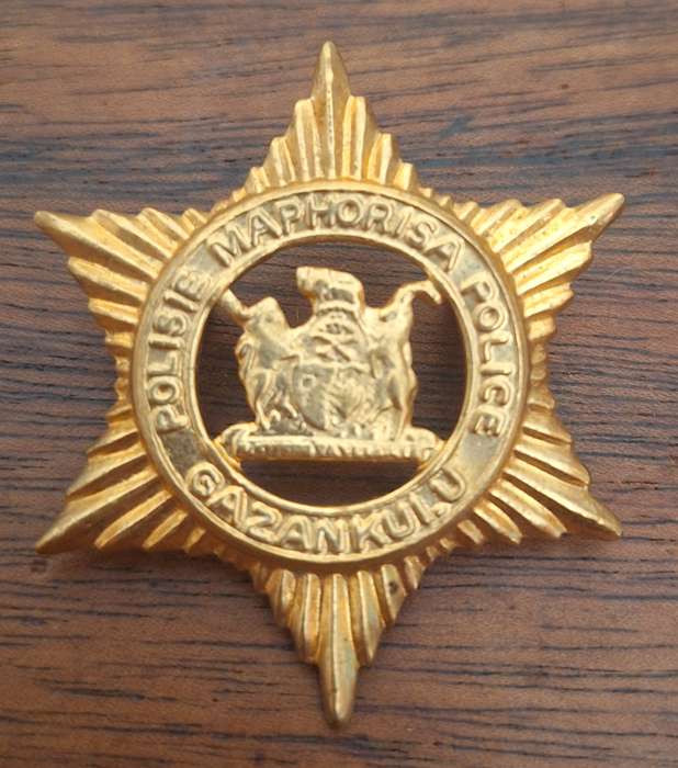 EX HOMELAND - GAZANKULU POLICE CAP BADGE - SCREWS INTACT