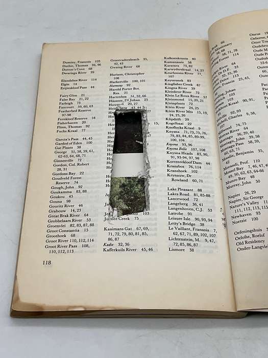 Book with pages cut to make a small hidden compartment