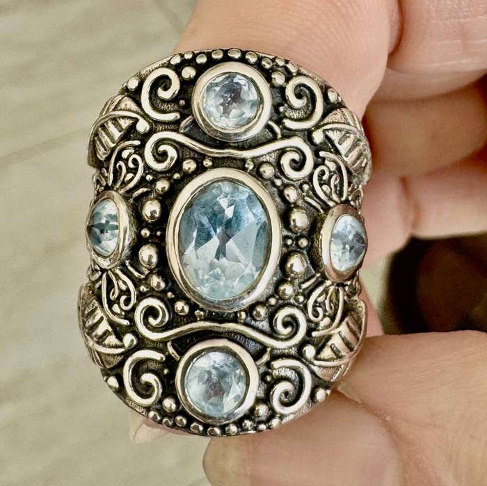 BROADBAND SOLID STERLING SILVER RING WITH NATURAL SWISS BLUE TOPAZ. TACTILE DECORATIVE DETAIL