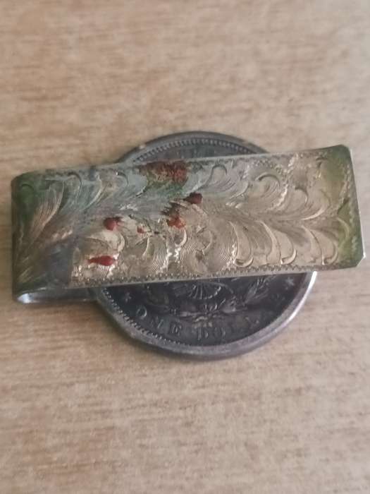 1883 Morgan Dollar with note clasp attached. 42.3gr 90% silver