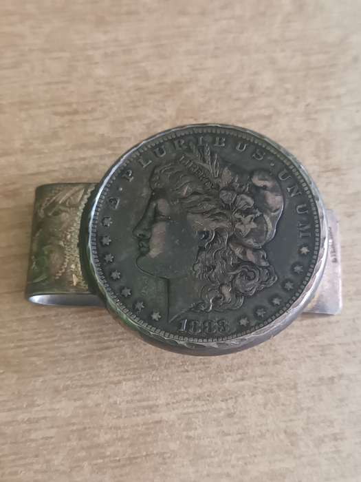 1883 Morgan Dollar with note clasp attached. 42.3gr 90% silver