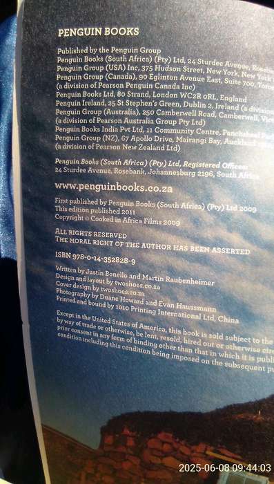 SIGNED.  "Cooked in Africa" Justin Bonello.  Soft cover.