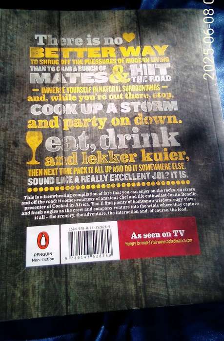 SIGNED.  "Cooked in Africa" Justin Bonello.  Soft cover.