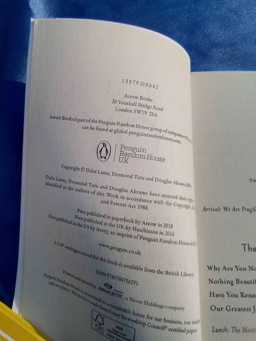 "The Book of Joy"  Dali Lama and Desmond Tutu.  Soft   cover.