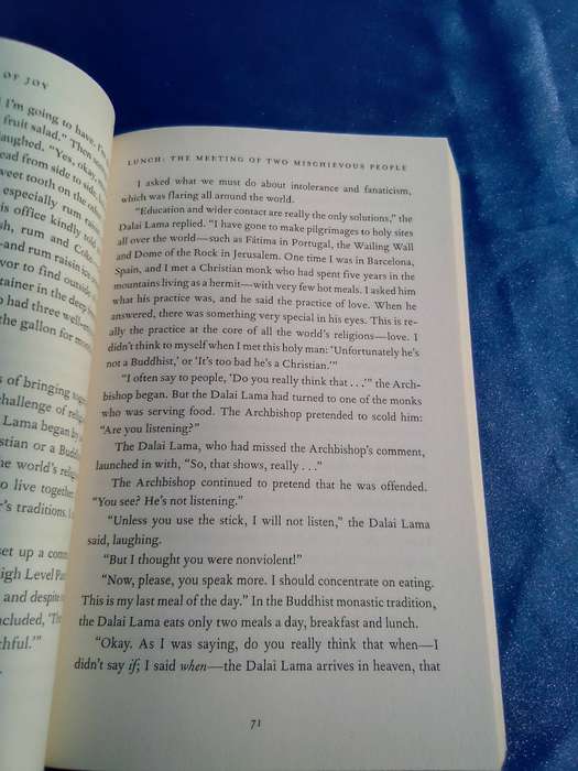 "The Book of Joy"  Dali Lama and Desmond Tutu.  Soft   cover.