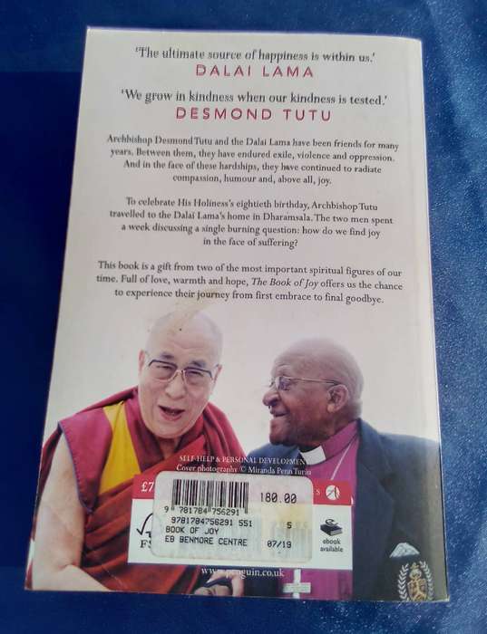 "The Book of Joy"  Dali Lama and Desmond Tutu.  Soft   cover.