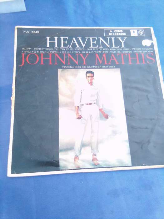 L.P. Johnny Mathis. Heavenly.  Cover:  Water damaged. L.P.:Very good.