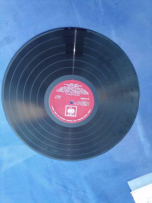 L.P. Johnny Mathis. Heavenly.  Cover:  Water damaged. L.P.:Very good.