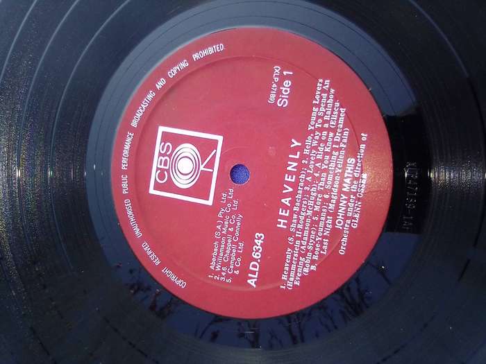 L.P. Johnny Mathis. Heavenly.  Cover:  Water damaged. L.P.:Very good.