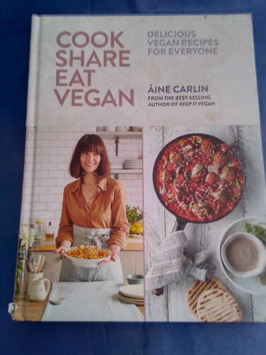 "Cook Share Eat Vegan". Hard cover.