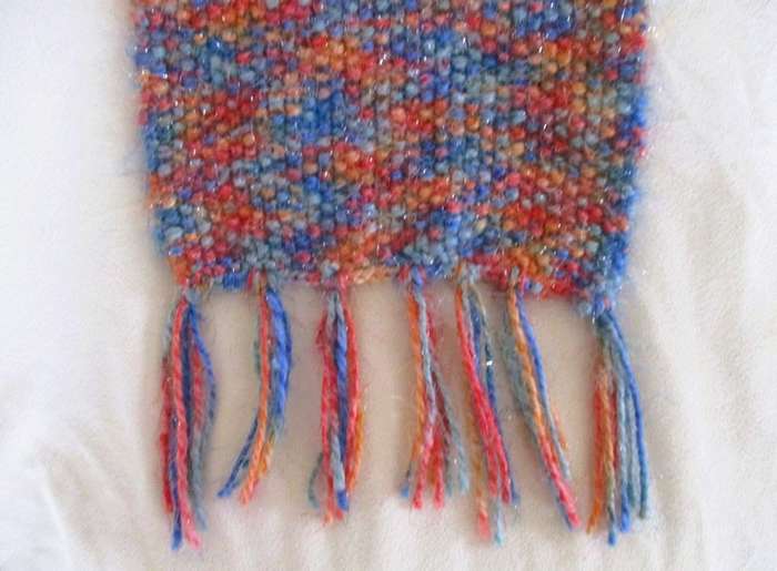 Beautiful, thick hand knitted scarf with shiny thread running through it