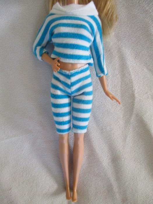 A pretty Mattel Barbie doll  in cute striped tracksuit