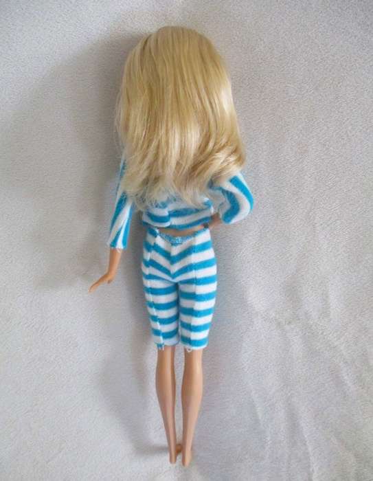 A pretty Mattel Barbie doll  in cute striped tracksuit