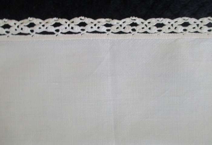 A vintage,  expertly embroidered square cloth with anemones and crocheted border