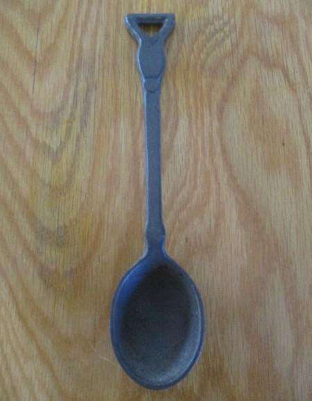 Three vintage solid cast iron ladles