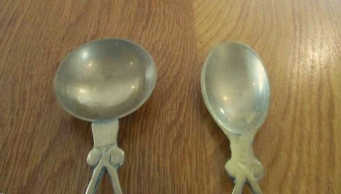 Two ornate Welsh-style solid brass Love Spoons made in India