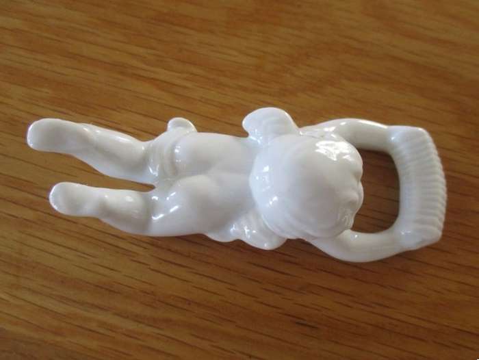 Eight beautiful blanc de chine cherub wall hangers/serviette holders/ornaments