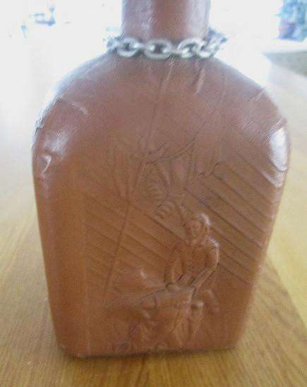 Two beautifully decorative Spanish hand made leather embossed decanters
