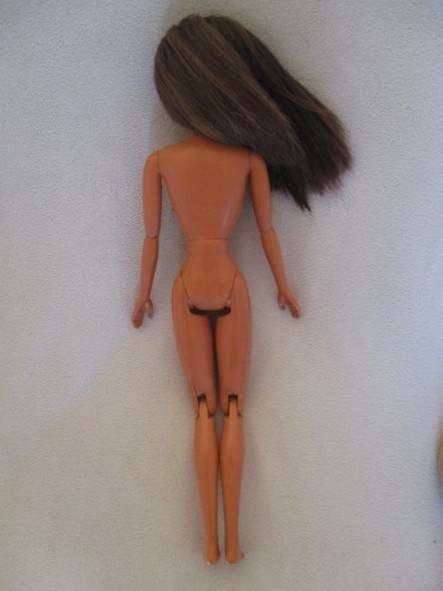 Pretty articulated Mattel Barbie with original top and earrings - Operations Safari Barbie?
