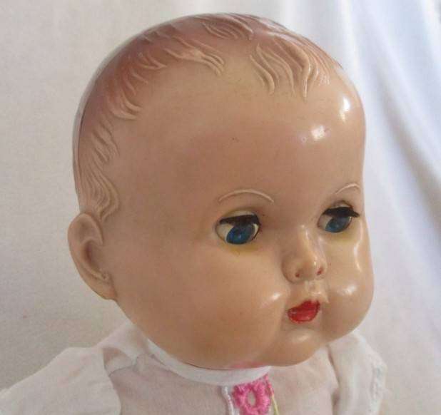 Vintage hard plastic doll made in England