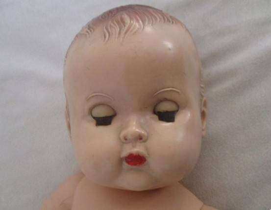 Vintage hard plastic doll made in England