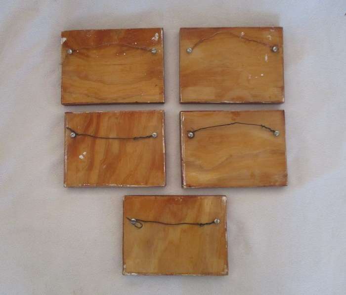 Five hand painted wooden wall plaques with various butterflies