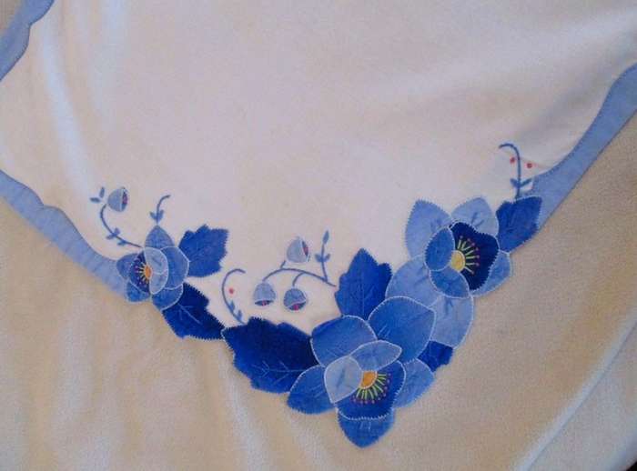 Two rectangular and one square vintage appliqued and embroidered cloths with beautiful water lilies