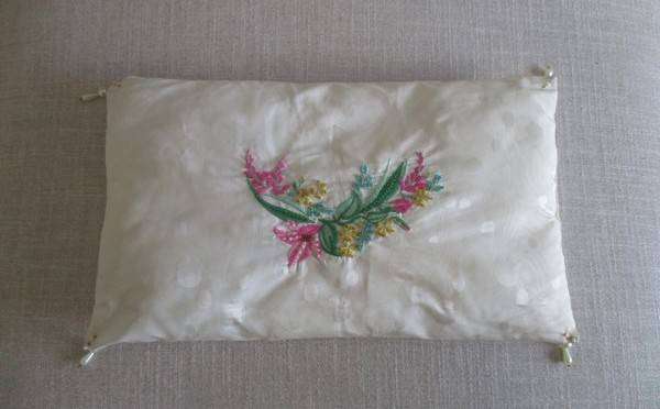 A pretty beaded and embroidered cushion