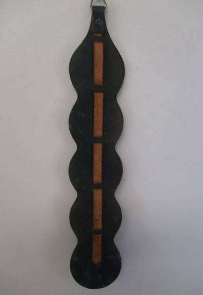 Five rather large horse brasses on leather strap